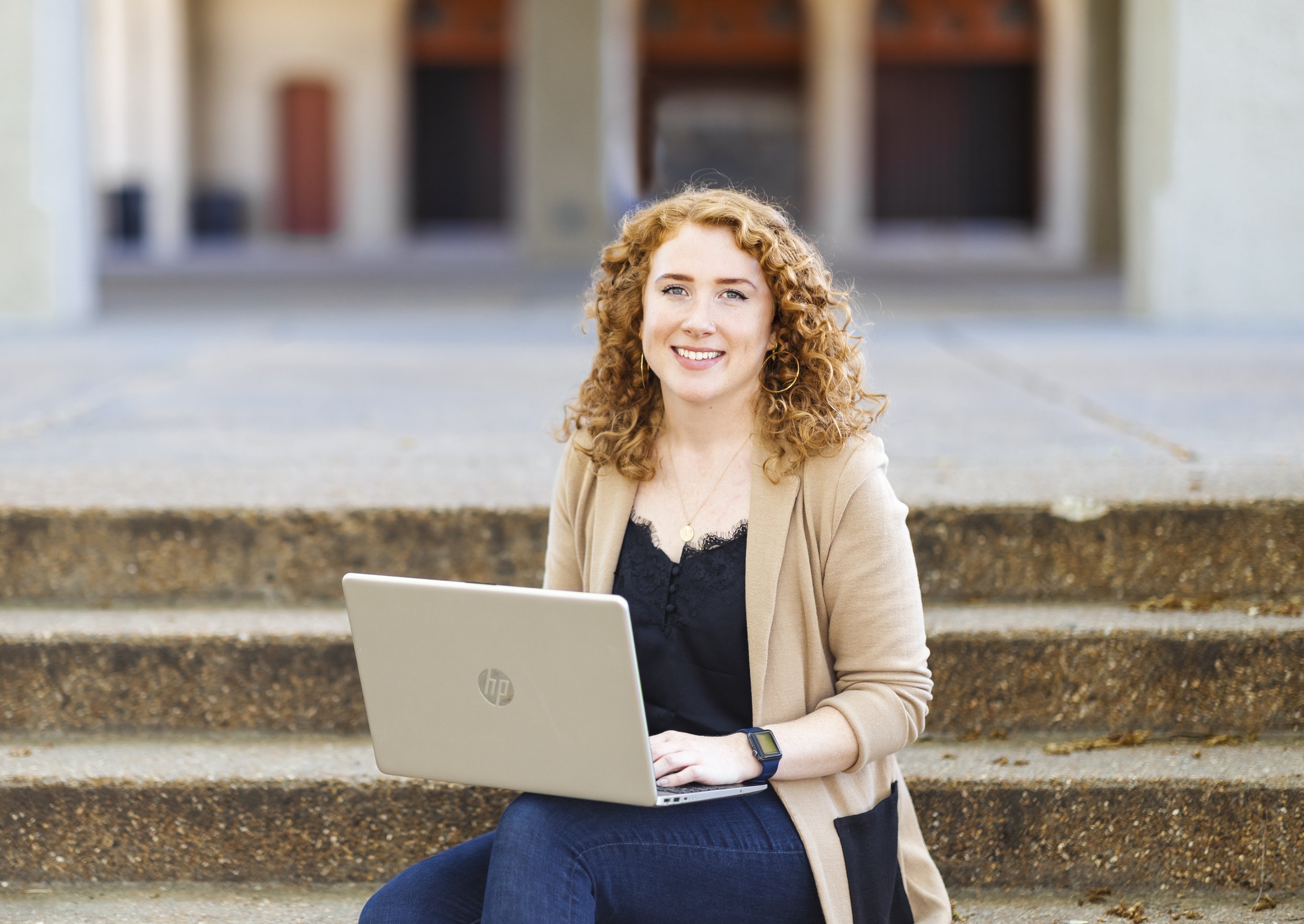 Pretty lady holding laptop